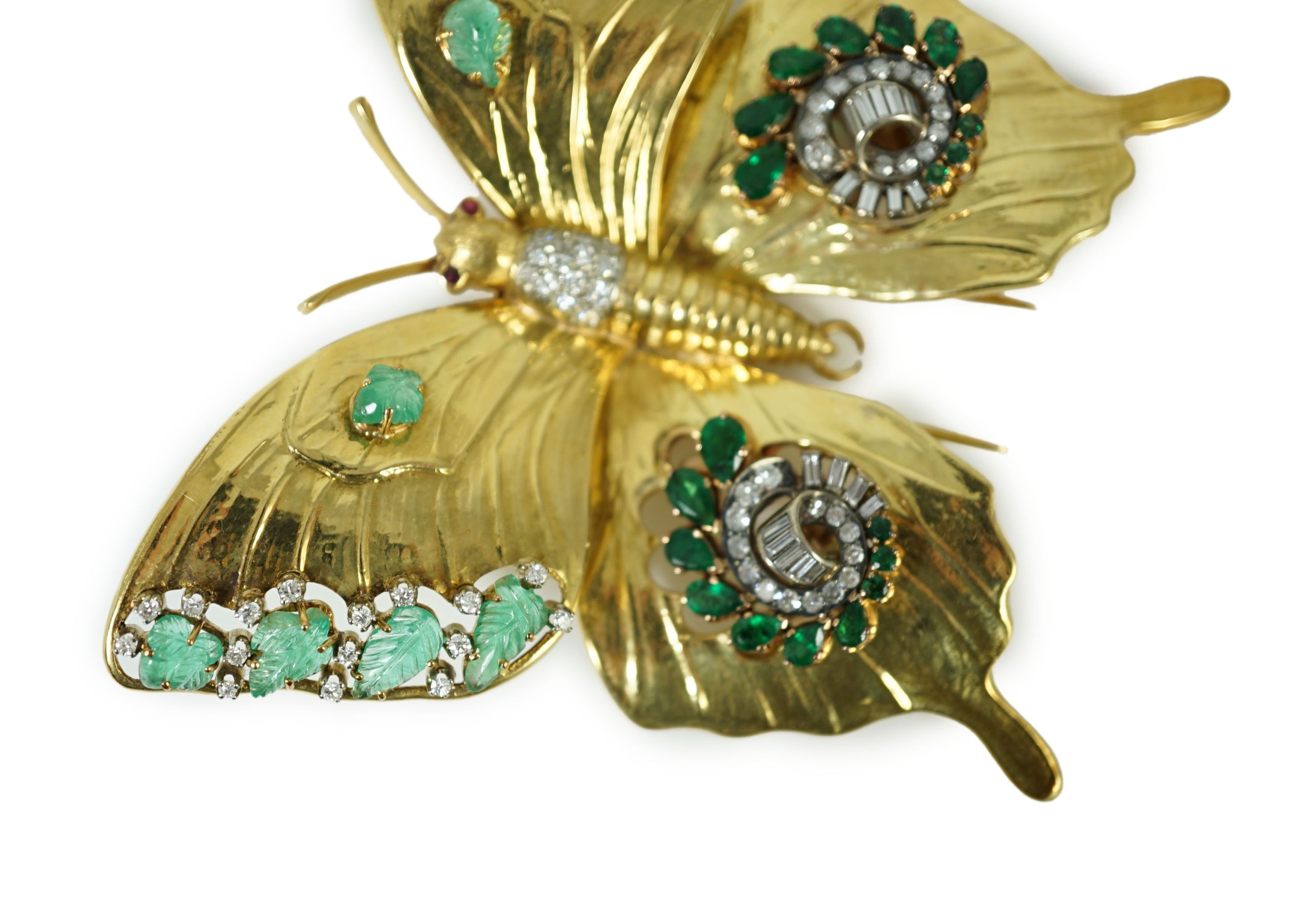 A modern 18ct gold, emerald and diamond set butterfly clip brooch
